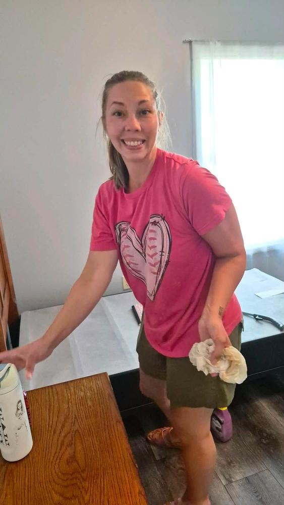 A volunteer cleaning and preparing a room